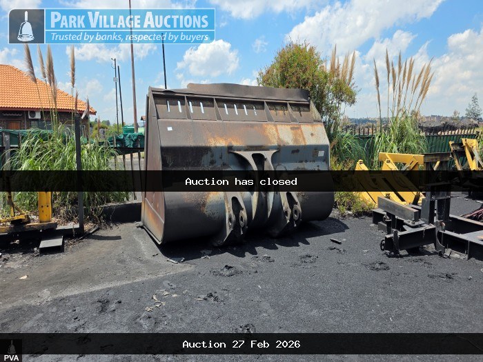 LOT ASSORTED STEEL SCRAP NEXT TO RED CONTAINER