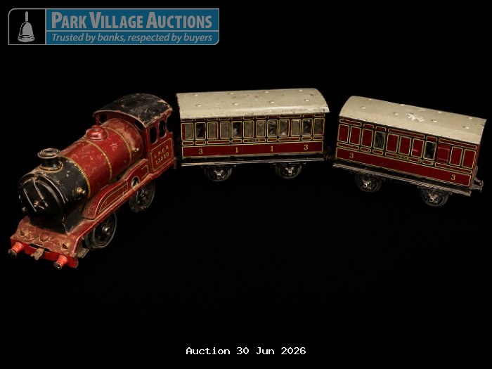 HORNBY VINTAGE TIN TRAIN SET WITH RED LOCOMOTIVE AND MATCHING CARRIAGES