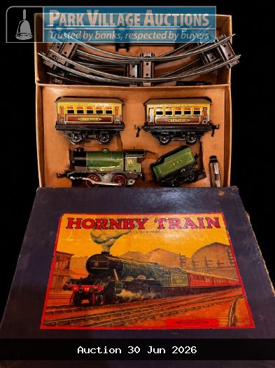 RARE HORNBY VINTAGE CLOCKWORK TRAIN SET WITH LOCOMOTIVE, CARRIAGES, TRACK AND ORIGINAL BOX.