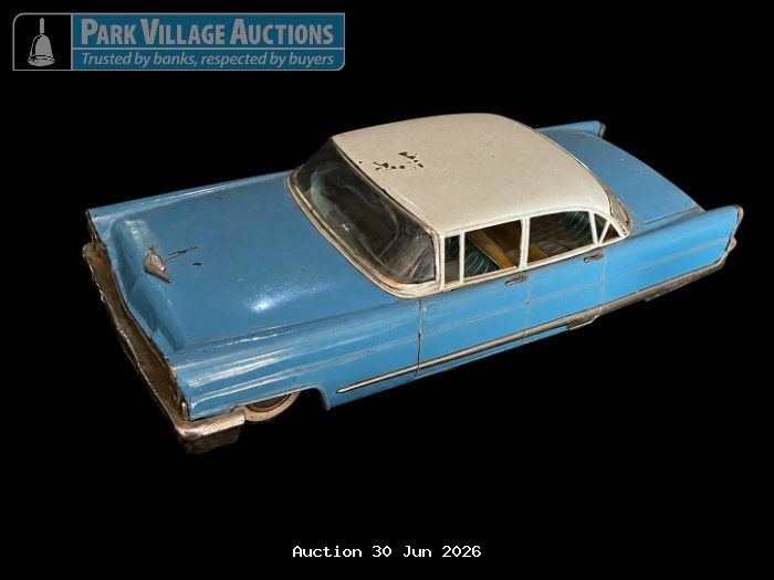 VINTAGE BLUE AND WHITE TIN MODEL CAR WITH CLASSIC STYLING