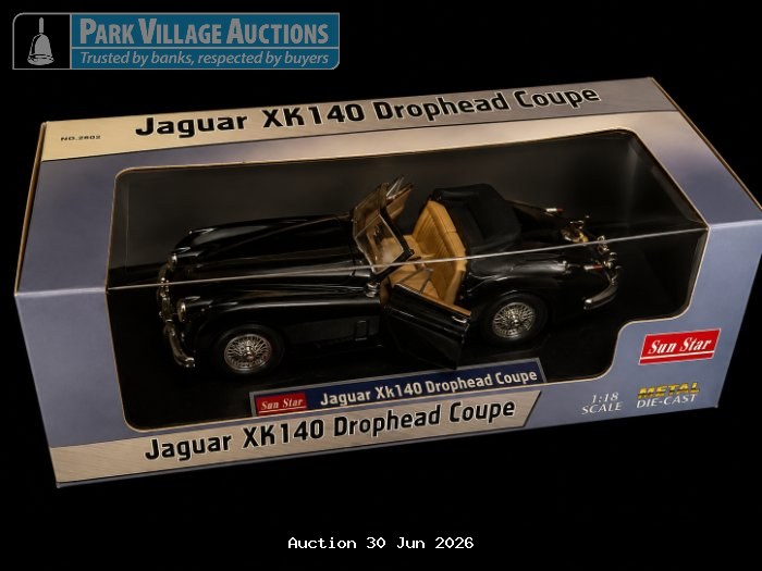 BOXED SUN STAR JAGUAR XK140 DROPHEAD COUPE DIE-CAST MODEL CAR WITH DETAILED PACKAGING.
