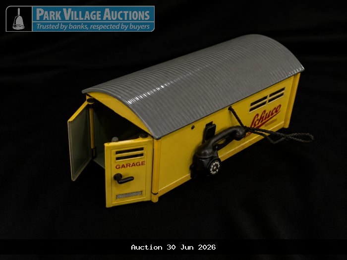 YELLOW SCHUCO TOY GARAGE WITH GREY ROOF, OPENING DOOR AND TELEPHONE DETAIL