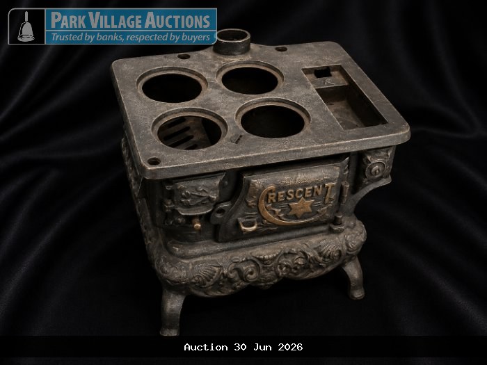 VINTAGE CRESCENT TOY STOVE WITH ORNATE METAL DETAILING