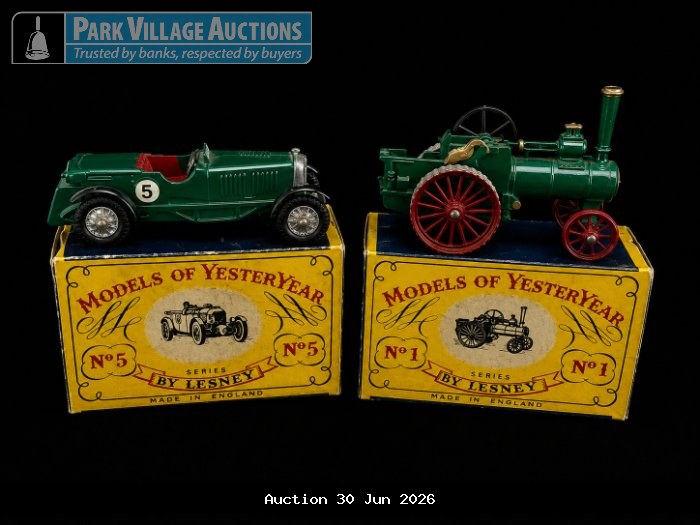 TWO GREEN MATCHBOX MODELS OF YESTERYEAR COLLECTIBLES, INCLUDING A VINTAGE RACING CAR AND STEAM TRACTOR, DISPLAYED ON ORIGINAL LESNEY BOXES.