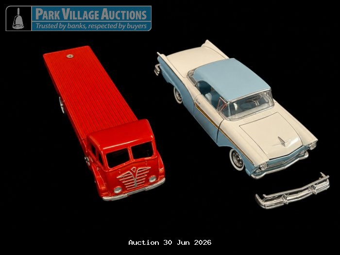 RED VINTAGE DIE-CAST FLATBED TRUCK WITH A CREAM AND LIGHT BLUE CLASSIC CAR MODEL