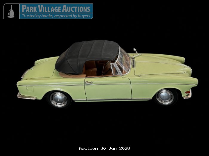 LIGHT GREEN DIE-CAST CLASSIC CONVERTIBLE MODEL CAR WITH BLACK SOFT-TOP ROOF AND CHROME DETAILING