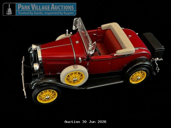 1931 FORD MODEL A, RED VINTAGE-STYLE DIE-CAST ROADSTER MODEL WITH BLACK FENDERS, YELLOW SPOKED WHEELS, CREAM UPHOLSTERY