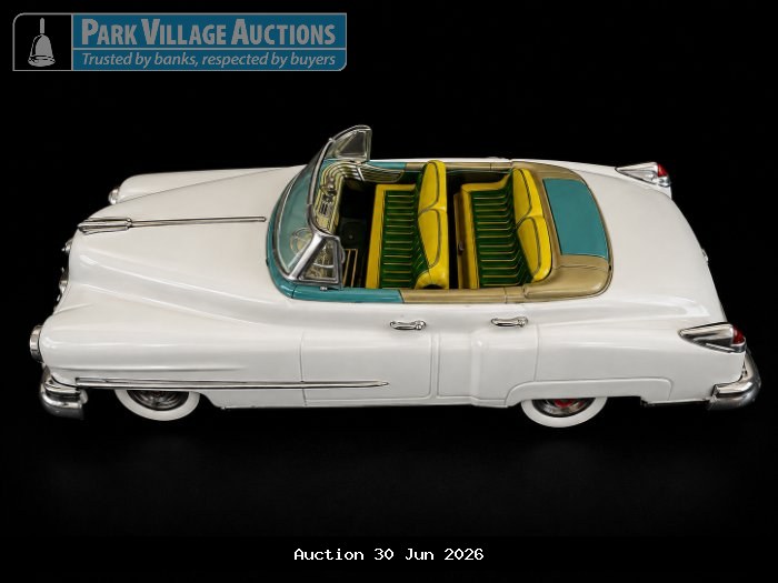 WHITE VINTAGE-STYLE DIE-CAST CONVERTIBLE MODEL WITH YELLOW AND GREEN INTERIOR,