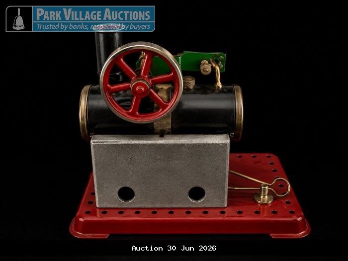 VINTAGE TABLETOP STEAM ENGINE MODEL WITH BLACK BOILER, RED FLYWHEEL, SILVER BURNER HOUSING AND RED METAL BASE