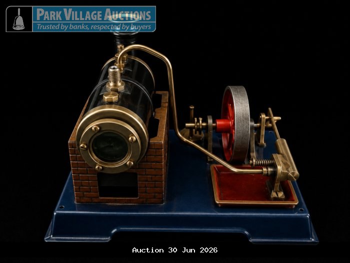 VINTAGE TABLETOP STEAM ENGINE MODEL WITH BLACK BOILER, BRASS FITTINGS, RED FLYWHEEL AND BLUE METAL BASE