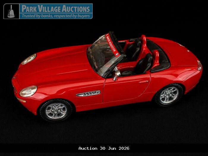 RED BMW Z8-STYLE DIE-CAST CONVERTIBLE MODEL WITH BLACK INTERIOR, CHROME WHEELS AND ROADSTER DETAILING
