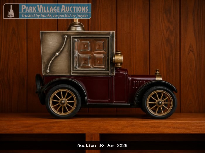 VINTAGE-STYLE DECORATIVE MODEL CAR WITH A BURGUNDY BODY, GOLD WHEELS AND METALLIC DETAILING