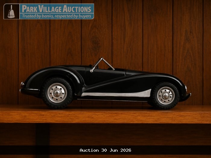 VINTAGE-STYLE BLACK CONVERTIBLE SPORTS CAR MODEL WITH SILVER DETAILING