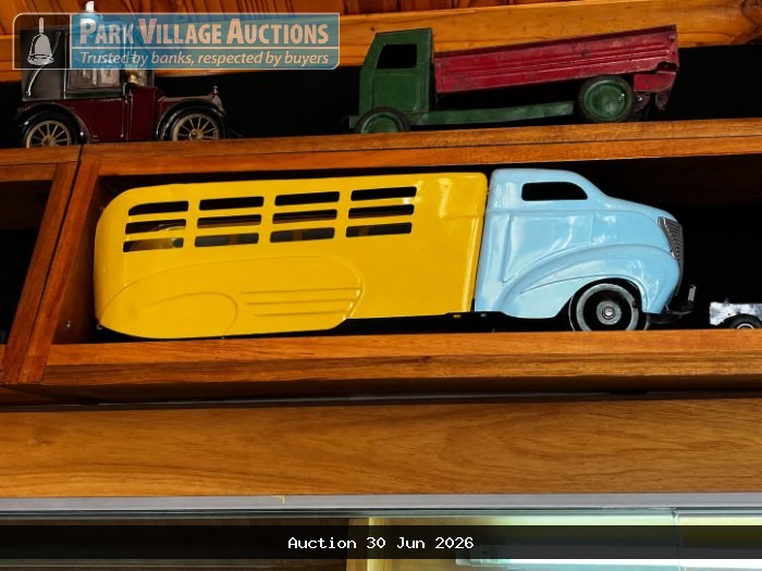 VINTAGE-STYLE YELLOW AND LIGHT BLUE TOY BUS MODEL WITH A STREAMLINED BODY