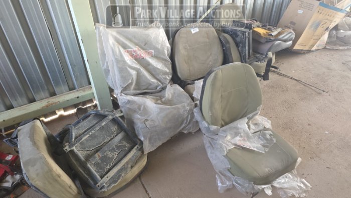 ASSORTED OLD LAND CRUISER SEATS INSIDE STEEL SHELTER